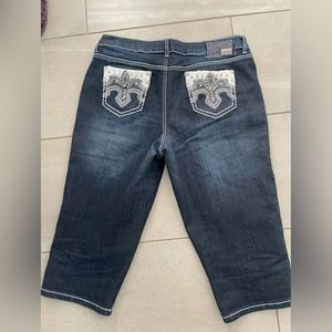 Dark wash capri jeans with embellishment